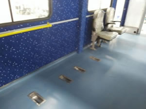 Fixed seats and wheelchairs are installed inside the truck